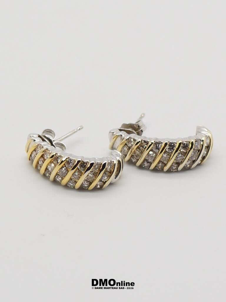 Two-tone hoop earrings with gold diagonal bands and embedded stones on a white background (DMOnline watermark).