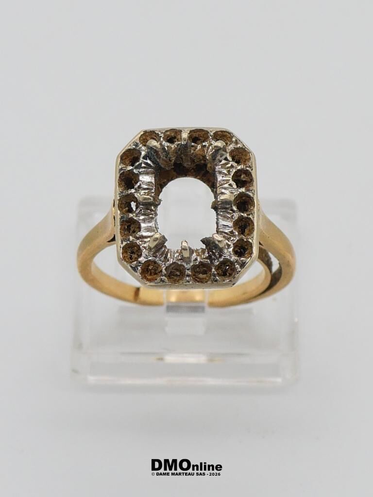 Gold ring with a square halo setting, brown stones surrounding an empty center.