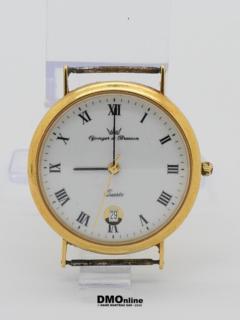 Gold-tone round wristwatch with white dial, Roman numerals, and a date window showing 29.