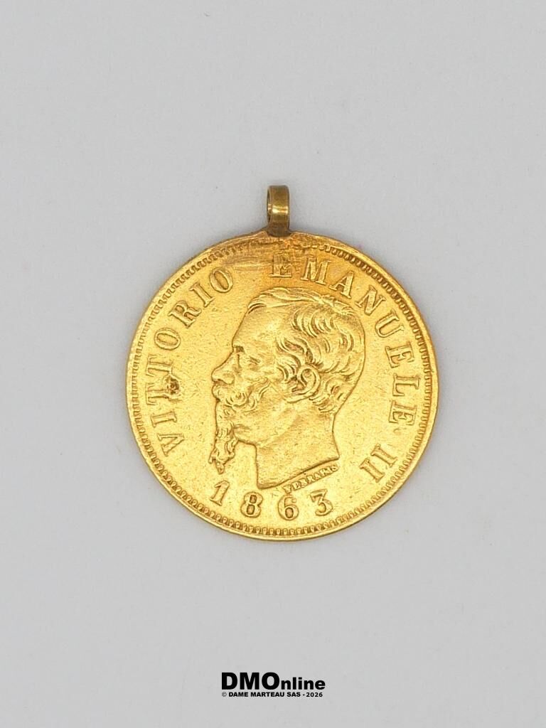 Gold pendant shaped like a coin showing Vittorio Emanuele II in profile and the year 1863, with a small loop at the top.